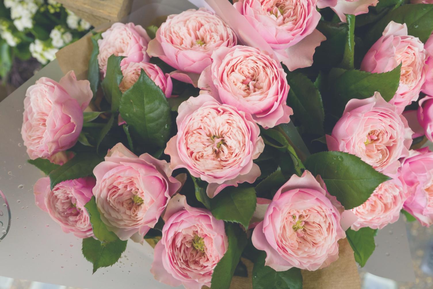 Elegant seasonal floral arrangement in modern corporate lobby showcasing professional design expertise