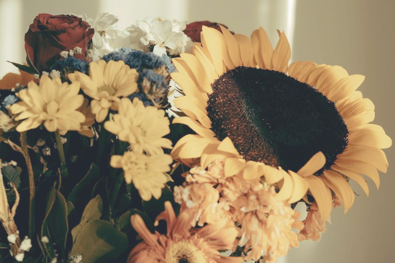 Sophisticated seasonal arrangement in modern office reception area demonstrating corporate floral design